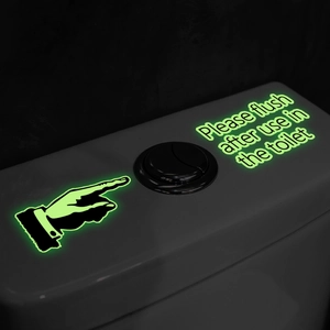 Luminous toilet flush sign decal with hand gesture in bright glow green for dark bathroom