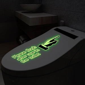 Luminous green 'Please flush after use' sign sticker for toilet in dark bathroom