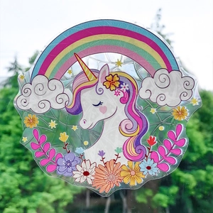 Gros plan sur l'autocollant licorne arc-en-ciel avec effets de lumière prismatiques