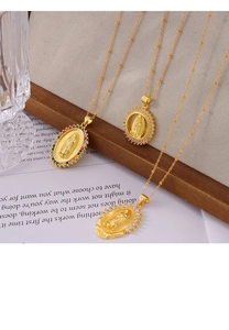 Detail shot of gold religious necklaces with Virgin Mary pendants and colored zircon stones