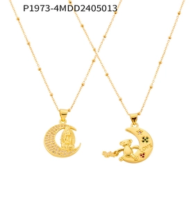 Detail of 18K gold moon pendants with Virgin Mary and LOVE bear in satellite chain