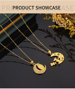 Detailed shot of gold moon pendants with religious icons and micro-inlaid rhinestones