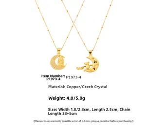 Macro detail of gold-plated crescent moon pendant with love bear and religious icon