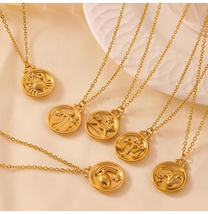 Detailed close-up of zodiac constellation pendants on gold-plated round coin necklaces