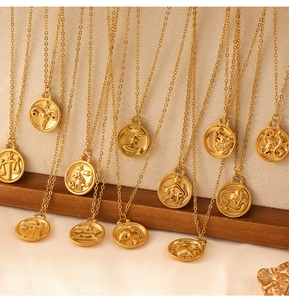Macro detail of gold-plated zodiac coin pendants on delicate O-chains for necklaces