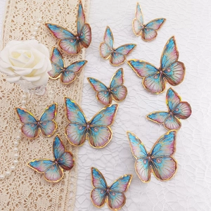 Detailed close-up of 3D gradient pink blue butterfly wall stickers with golden edges