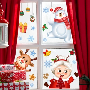 Detailed Christmas window stickers with Santa, reindeer and snowflakes on a white window