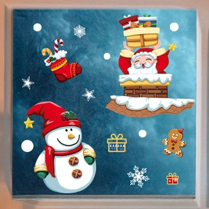 Detailed view of Christmas window decals featuring Santa, snowman, and snowflakes on glass