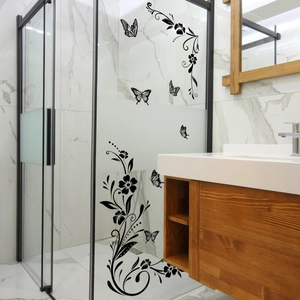 Floral butterfly wall stickers on glass shower door in modern bathroom setting