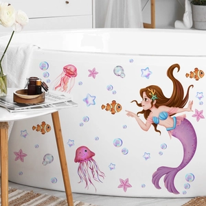 Waterproof mermaid and ocean life stickers applied on white bathtub in kids bathroom