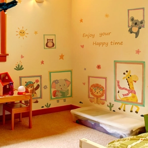 Cartoon animal wall stickers featuring giraffe and lion icons in a cozy nursery setting