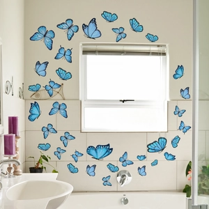 Stickers muraux papillons bleus autocollants décorant le contour d'une fenêtre de bain