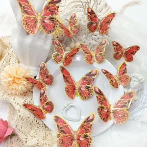 Set of 12 red 3D holographic butterfly wall stickers with golden edges and hollow design