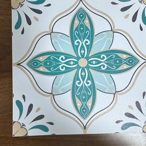 Detail of matte retro French floral tile sticker with blue mandala pattern design