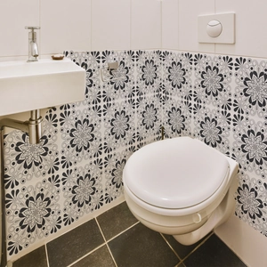 Waterproof mandala tile stickers in black and white applied to bathroom backsplash wall