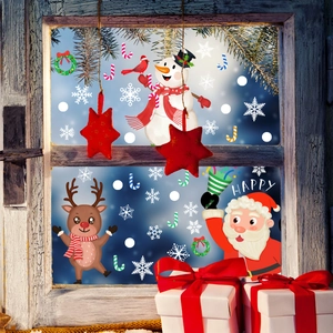 Adesivi natalizi per finestre con Babbo Natale e renne su decorazioni in vetro invernali