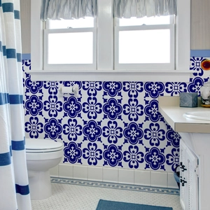 Close-up of waterproof Mediterranean blue and white geometric tile stickers in a bathroom