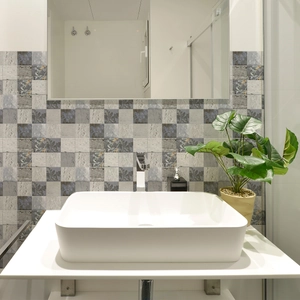 Detail of vintage floral mosaic tiles on a kitchen wall with waterproof marble texture