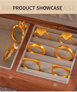 Detail view of 18k gold plated geometric rings with zircon inlay in a velvet display case