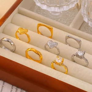 Collection of French vintage geometric zircon rings in 18k gold and silver finishes
