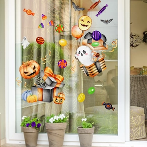 Watercolor Halloween static window clings with pumpkins, ghosts, and bats on a glass window