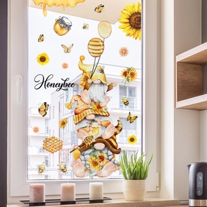 Detail van bijen en kabouters raamstickers met zonnebloemen en potten met honing
