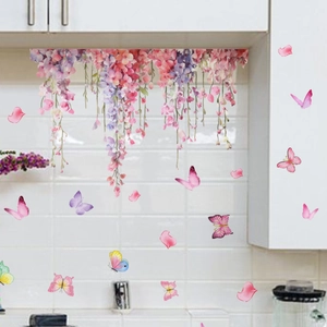 Detailed view of pink floral vines and butterfly wall stickers on white kitchen tiles