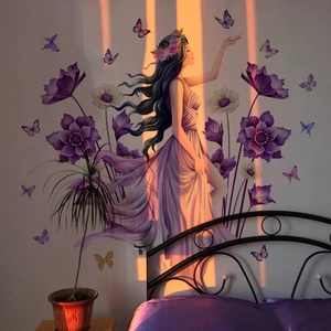 Detail of floral butterfly goddess wall decal applied on bedroom headboard wall