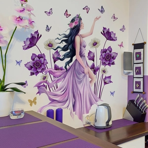 Detail of floral butterfly girl wall sticker showing purple flowers and matte PVC texture