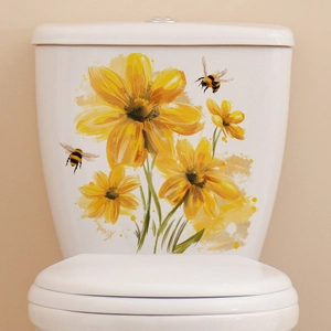 Detail of yellow sunflower and bee stickers on a white ceramic toilet water tank