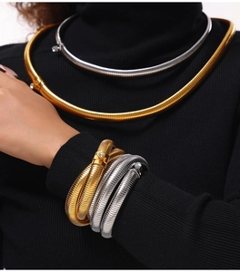 Detail of 18K gold plated flexible snake bone necklace with zircon inlaid clasp