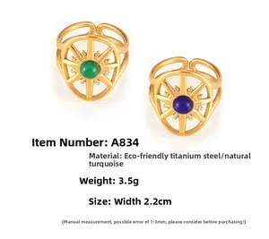 Macro detail of retro octagonal star rings in gold titanium steel with turquoise stones