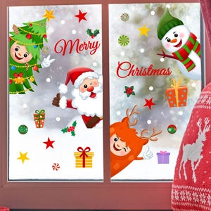 Detail view of Santa and snowman Christmas window stickers on glass with snow background