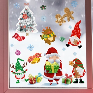 Festive Santa and reindeer static window stickers on glass with winter snowy backdrop