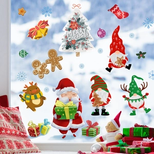 Detail of Christmas window clings with Santa Claus, Gnomes and Reindeer in cozy scene