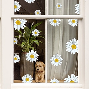Daisy floral window clings in various sizes on glass with cozy home interior background