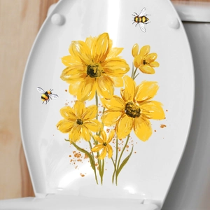 Détail de stickers pour toilettes avec tournesols et abeilles sur un abattant blanc