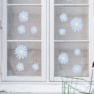 Blue daisy flower window decals with yellow centers on glass for home decoration