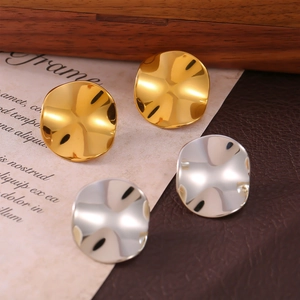 Minimalist 18k gold and silver plated irregular curved disc stud earrings on leather