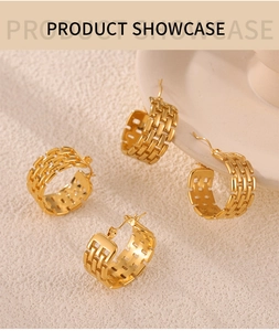 Detail of gold C-shaped earrings featuring intricate woven lattice and hollow pattern
