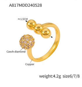 Macro detail of gold-plated copper ring with crystal spheres and Czech diamond pave