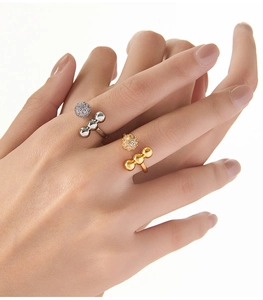 Detail of adjustable open rings with pave set rhinestones and metallic bead spheres