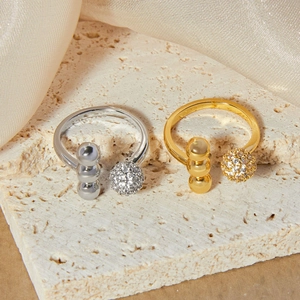 Luxe rhinestone spherical open ring set in gold and silver on stone and silk