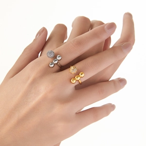 Luxurious spherical open ring with pavé cubic zirconia on polished gold and silver bands