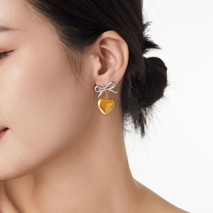 Boucles d'oreilles nœud et cœur doré en acier titane plaqué or 18 carats pour femme
