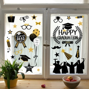 Black and gold graduation party window clings with 2024 Congrats Grad and stars design