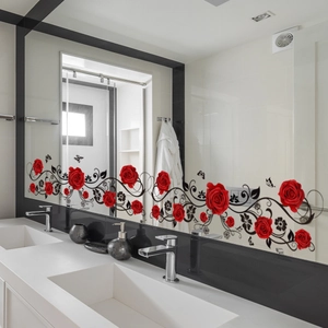 Detail of red rose and black vine mirror stickers with butterflies on bathroom glass