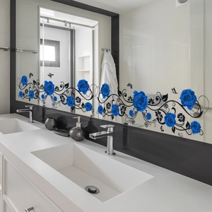Detail showing blue rose and butterfly decals applied to a modern bathroom mirror surface