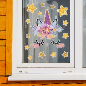 Detail of holographic unicorn window stickers with colorful stars and eyelashes