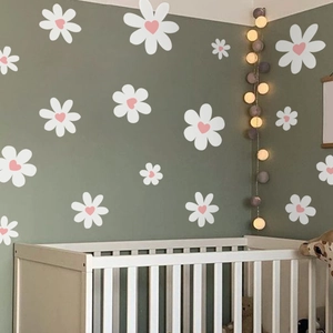 Daisy wall stickers with pink heart centers in various sizes for nursery room decoration